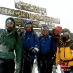 Kilimanjaro: At the Uhuru Peak sign on Kilimanjaro, 10 December 2004